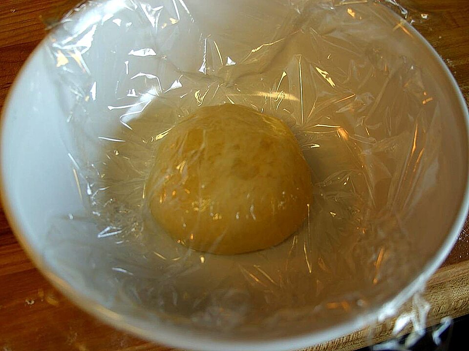 Making pizza dough in kitchen